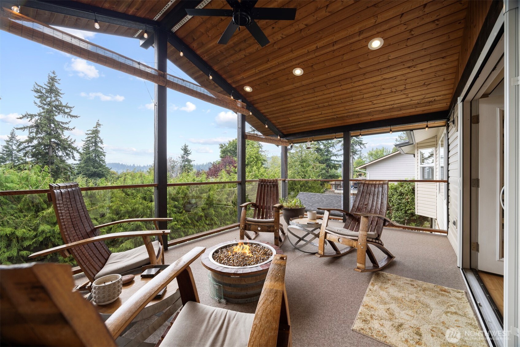 1000 Samish Way Bellingham, WA 98229 - Photo 7 of 40 a view of a patio with chairs and floor to ceiling window