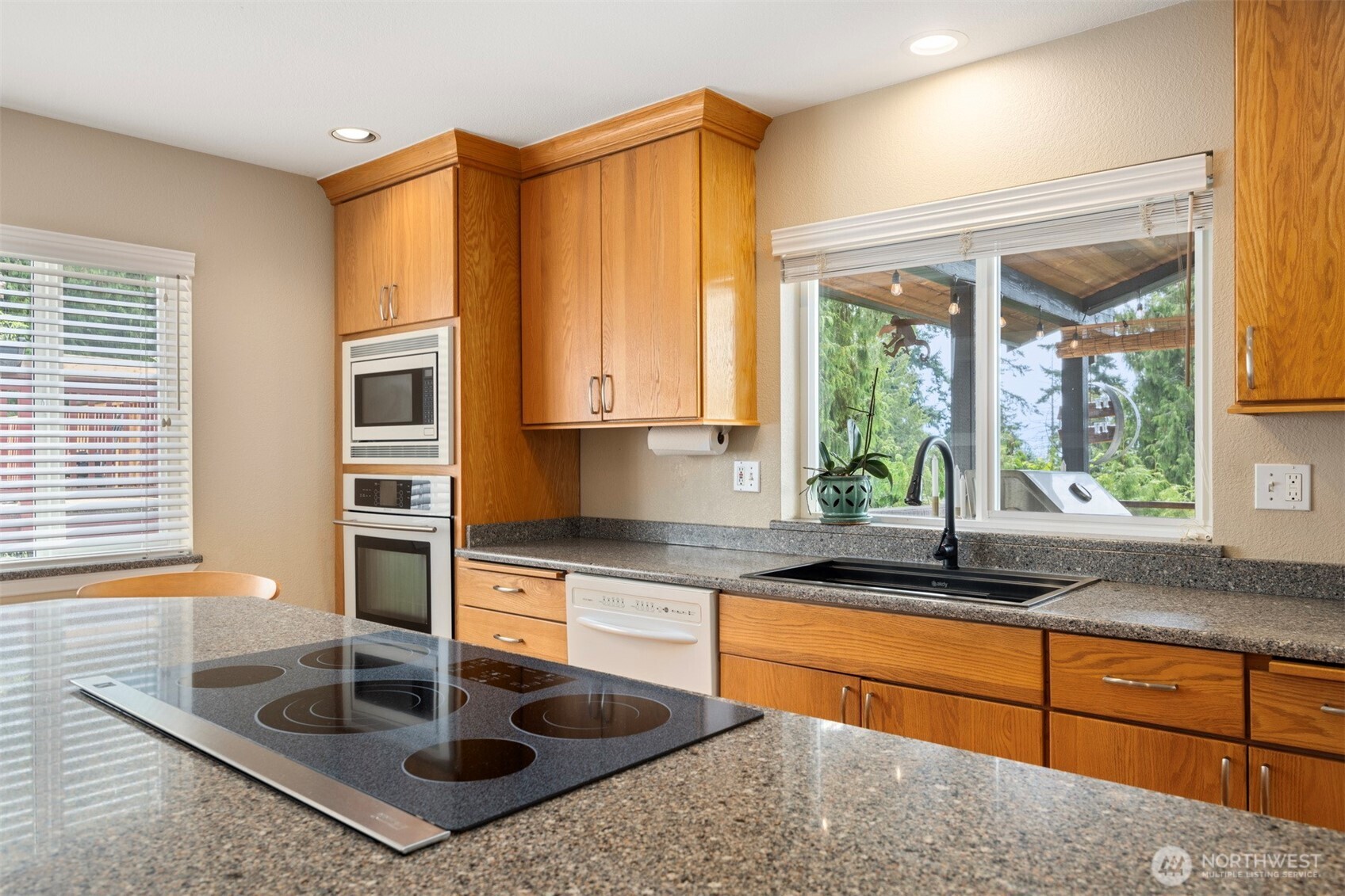 1000 Samish Way Bellingham, WA 98229 - Photo 9 of 40 a kitchen with sink a window and cabinets