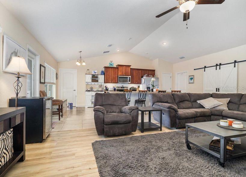 186 Northwest 44th Street Ocala, FL 34475 - Photo 12 of 36 a living room with furniture and a wooden floor