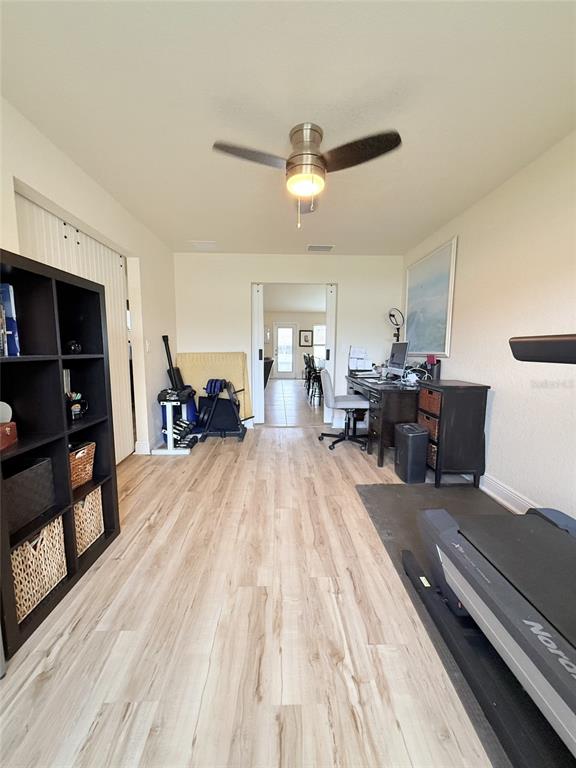 186 Northwest 44th Street Ocala, FL 34475 - Photo 18 of 36 a living room with furniture and a wooden floor