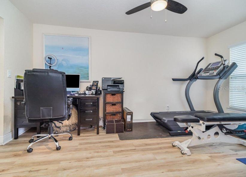 186 Northwest 44th Street Ocala, FL 34475 - Photo 20 of 36 a view of a workspace with furniture and gym equipment
