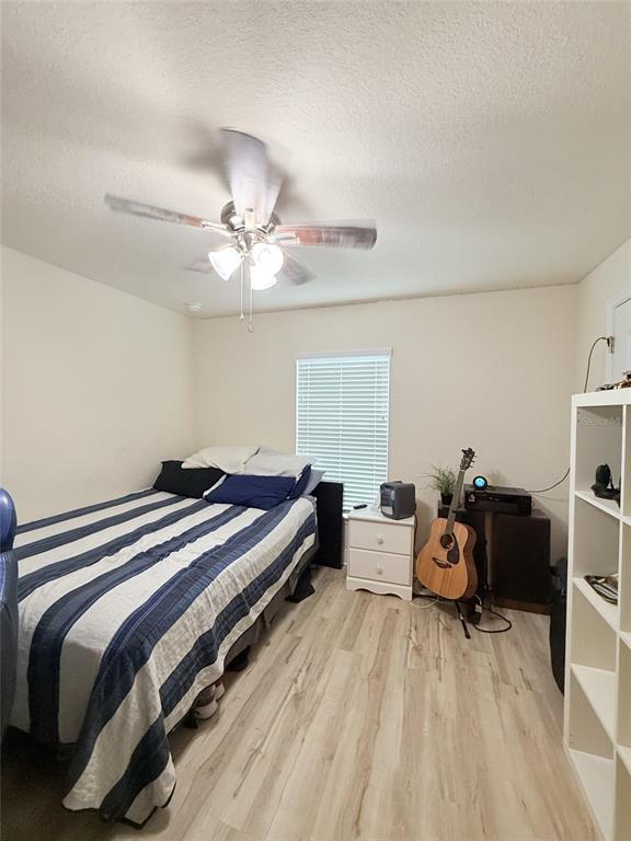 186 Northwest 44th Street Ocala, FL 34475 - Photo 21 of 36 a bedroom with a bed and furniture
