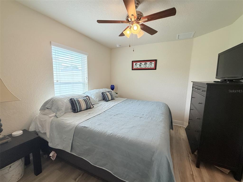 186 Northwest 44th Street Ocala, FL 34475 - Photo 25 of 36 a bedroom with a bed and a flat screen tv