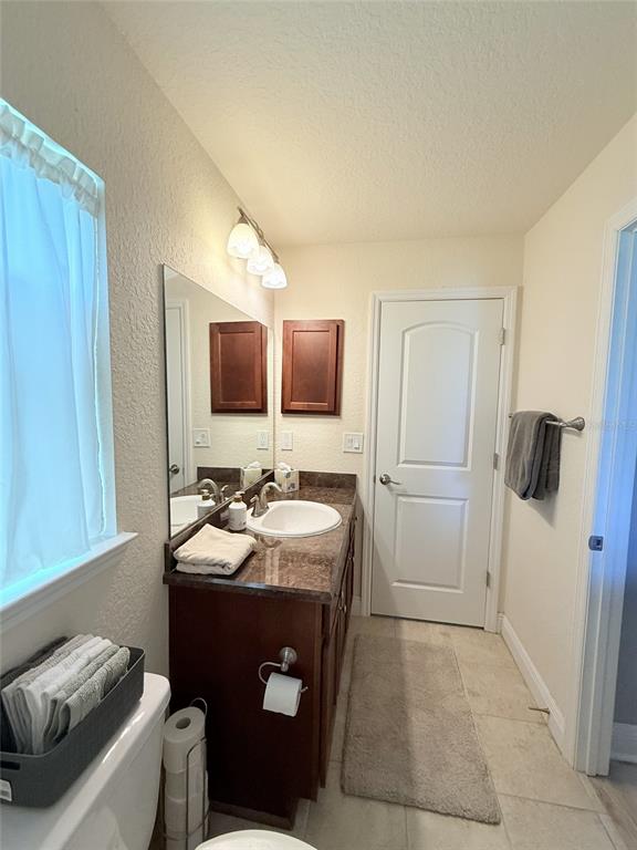 186 Northwest 44th Street Ocala, FL 34475 - Photo 27 of 36 a bathroom with a sink toilet and mirror