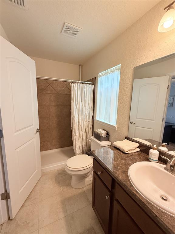 186 Northwest 44th Street Ocala, FL 34475 - Photo 28 of 36 a bathroom with a granite countertop sink toilet and shower