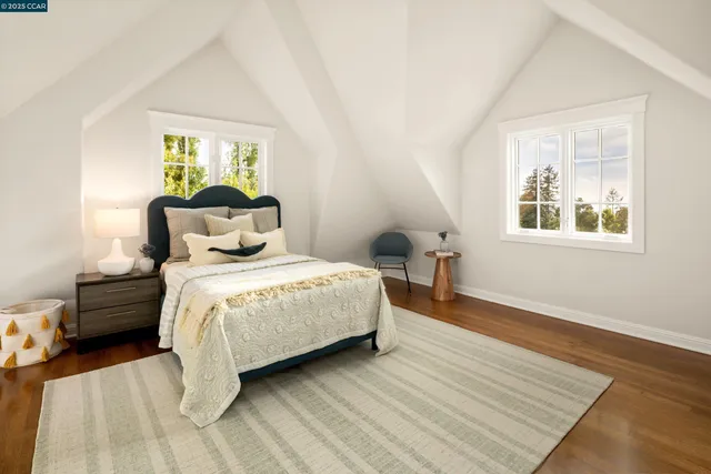 a living room with furniture a fireplace and a chandelier