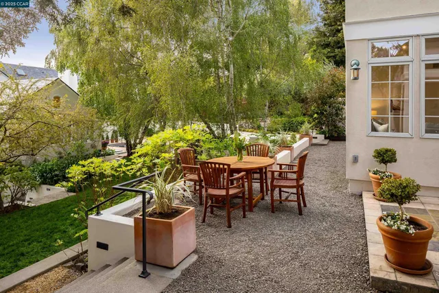 a bedroom with a bed and a large window with outer view