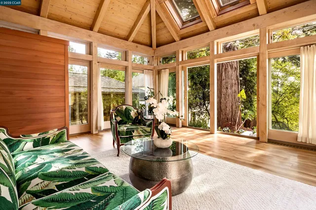 a view of a patio with table and chairs and potted plants
