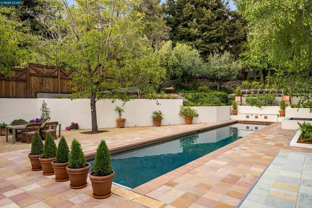 a view of backyard of house with outdoor seating