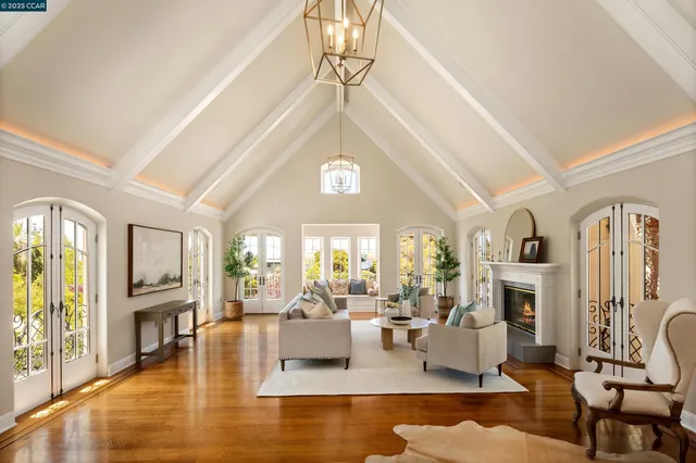 a living room with fireplace furniture and a fireplace