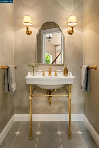 a bathroom with a sink a mirror and shower