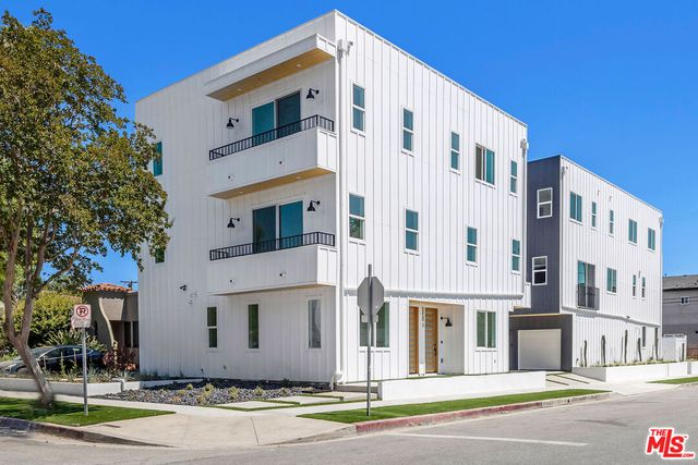 a view of a building with sitting area