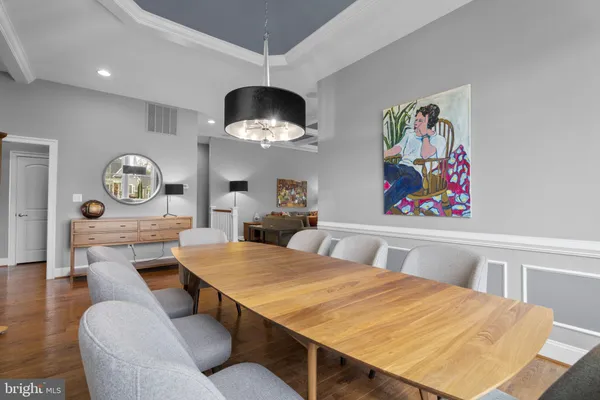a kitchen with a sink cabinets and wooden floor