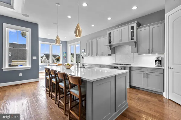 a dining room with furniture and wooden floor