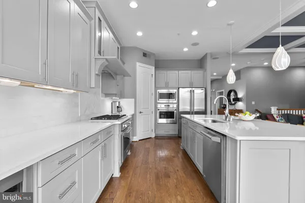 a spacious bedroom with a large bed and a large window