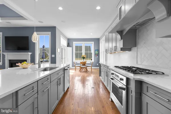 a spacious bathroom with a tub sink and mirror