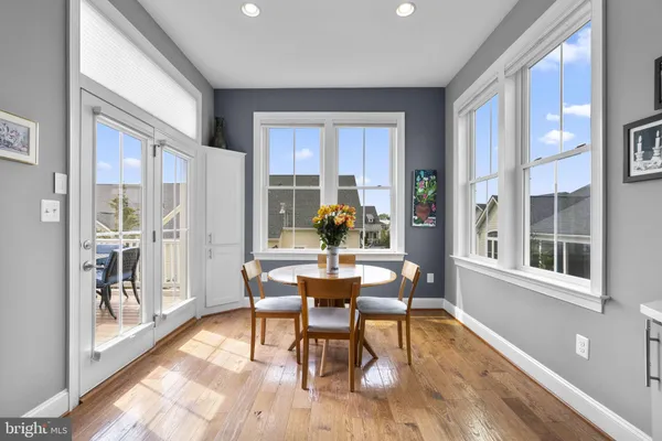 a bathroom with double vanity sinks a vanity a lamp and a mirror