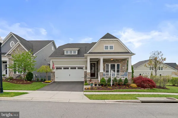 a view of a hallway view with floor to ceiling window and wooden floor