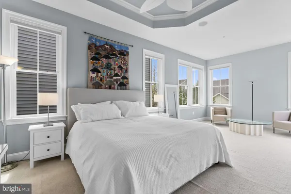 a living room with furniture a piano and a window