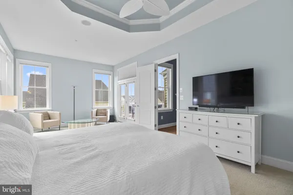 a living room with furniture and a work place area