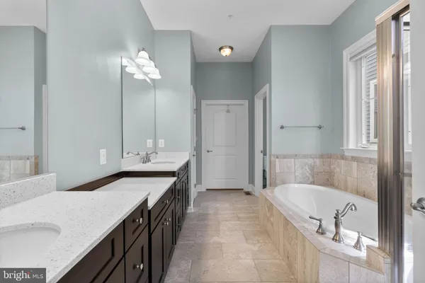 a view of a workspace with furniture bookshelf and a window