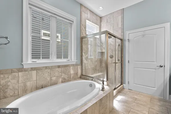 a utility room with sink dryer and washer