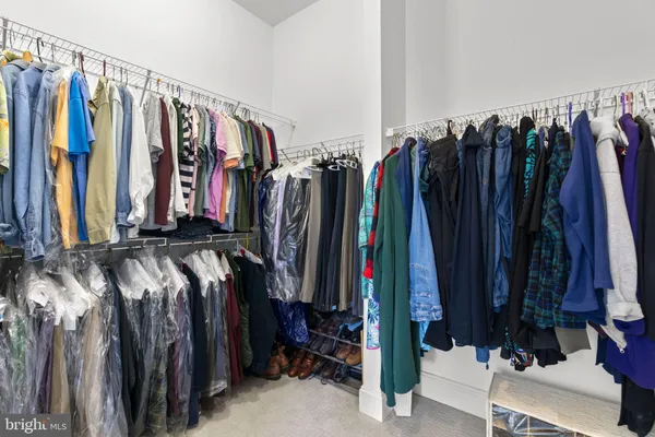 a kitchen with granite countertop a sink stove and cabinets