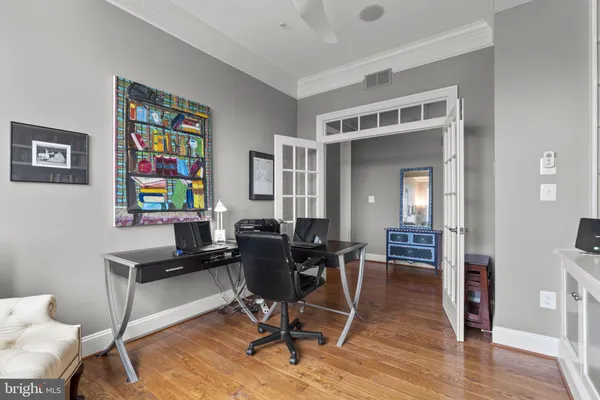 a view of a livingroom with furniture window and wooden floor