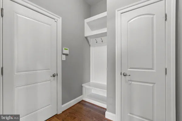 a living room with lots of furniture and a book shelf