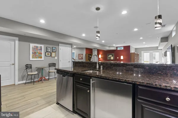 a view of house with a yard and potted plants