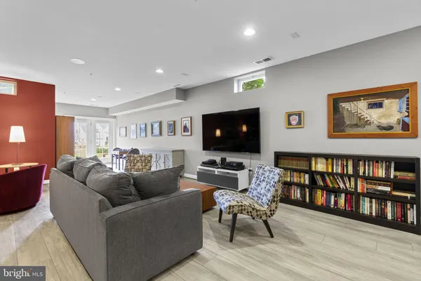 an aerial view of residential houses with outdoor space and swimming pool