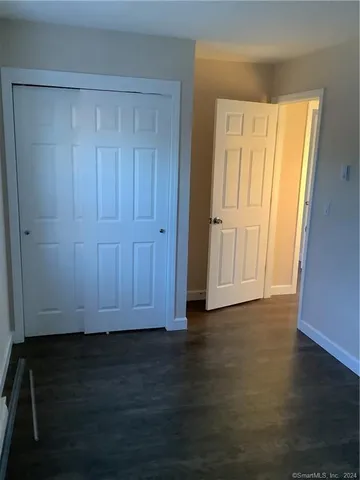 a view of wooden door and entryway