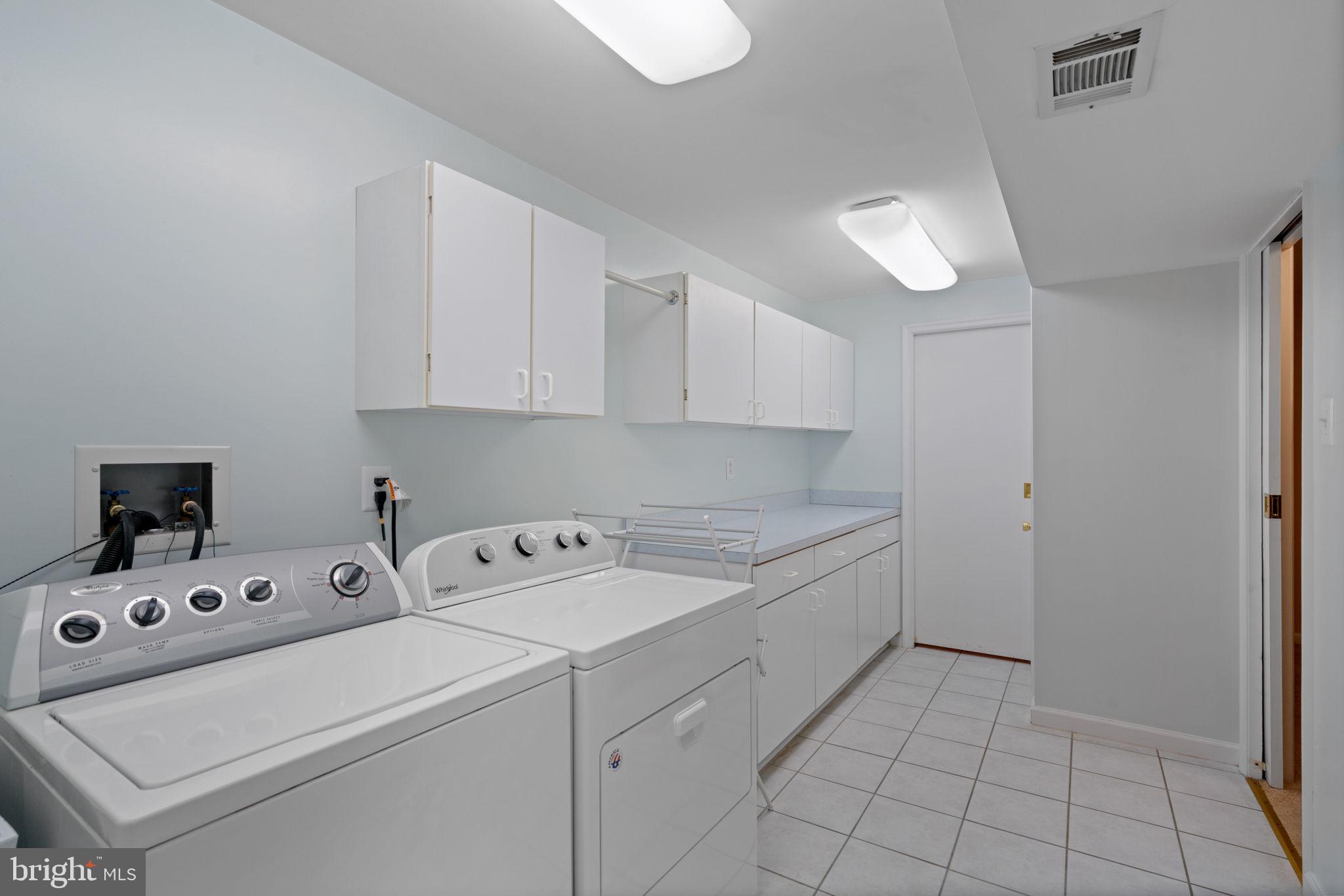 2416 Silver Fox Lane Reston, VA 20191 - Photo 50 of 60 Laundry Room w/Cabinets & Storage