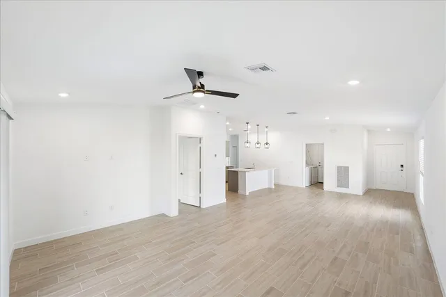 a view of a room that has a window in it