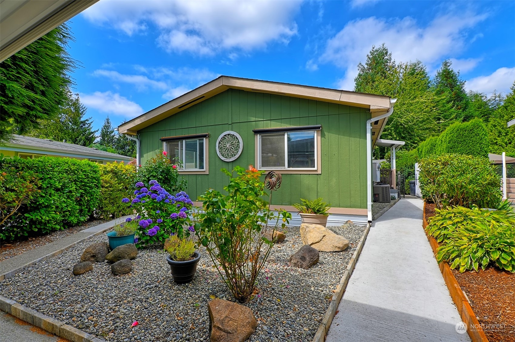 a house with lots of trees in the background