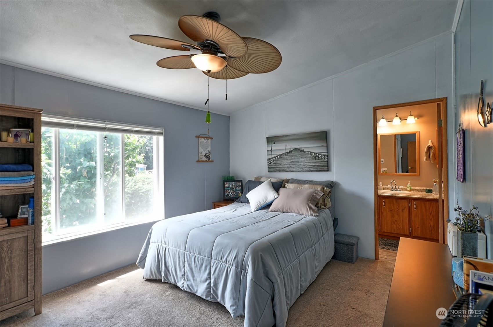 23825 15th Avenue Southeast, Unit 93 Bothell, WA 98021 - Photo 11 of 21 a bedroom with a bed and a chandelier