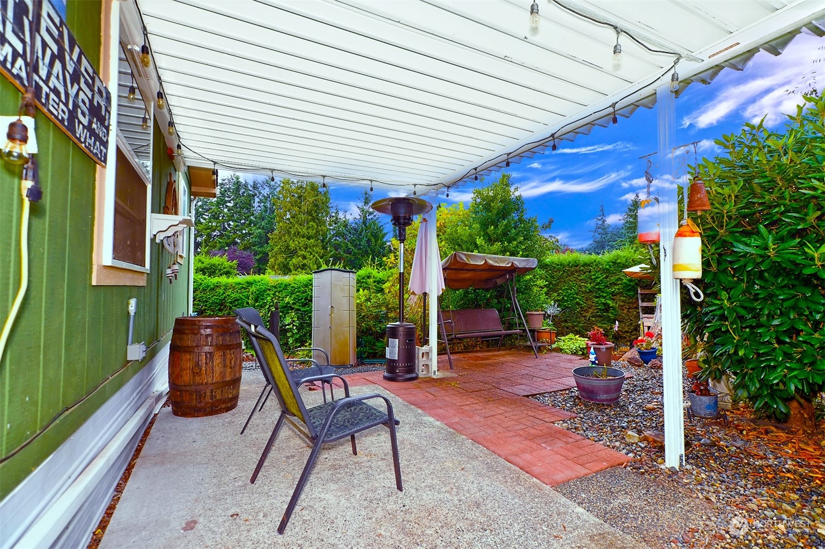 23825 15th Avenue Southeast, Unit 93 Bothell, WA 98021 - Photo 15 of 21 a patio with table and chairs and potted plants
