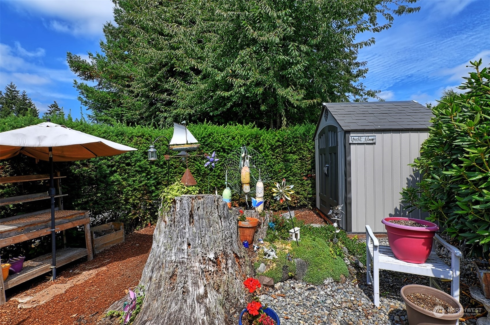 23825 15th Avenue Southeast, Unit 93 Bothell, WA 98021 - Photo 16 of 21 an outdoor space with seating area and trees