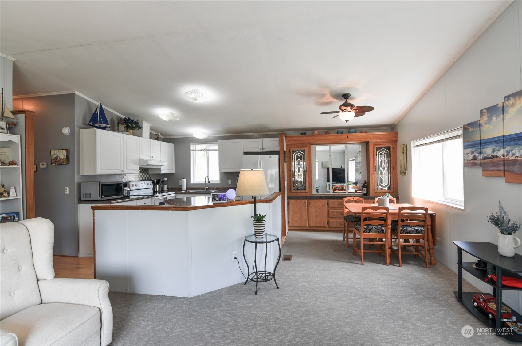 23825 15th Avenue Southeast, Unit 93 Bothell, WA 98021 - Photo 4 of 21 a living room with furniture a dining table and chairs