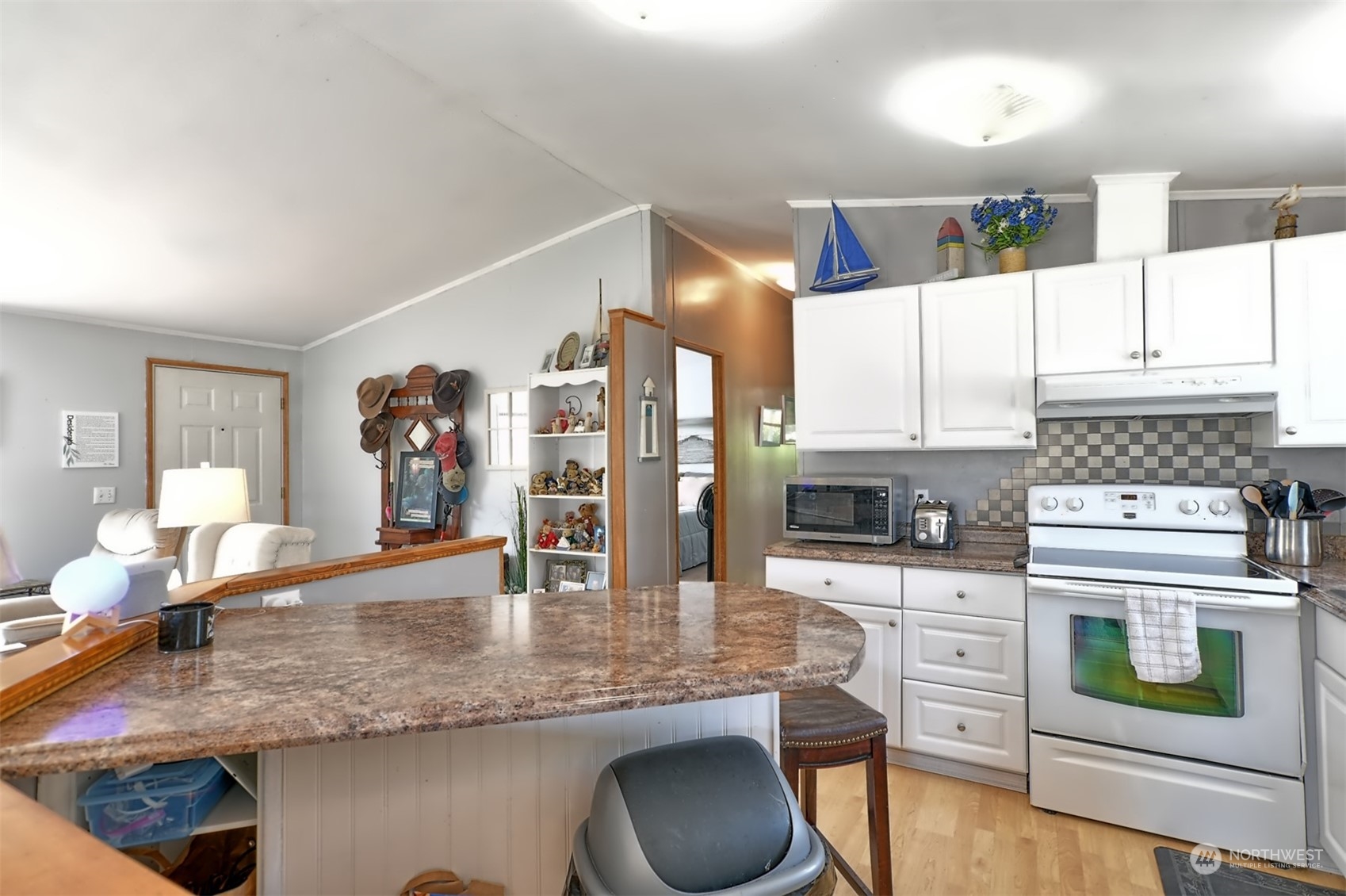 23825 15th Avenue Southeast, Unit 93 Bothell, WA 98021 - Photo 6 of 21 a kitchen with stainless steel appliances granite countertop a stove a sink and a microwave