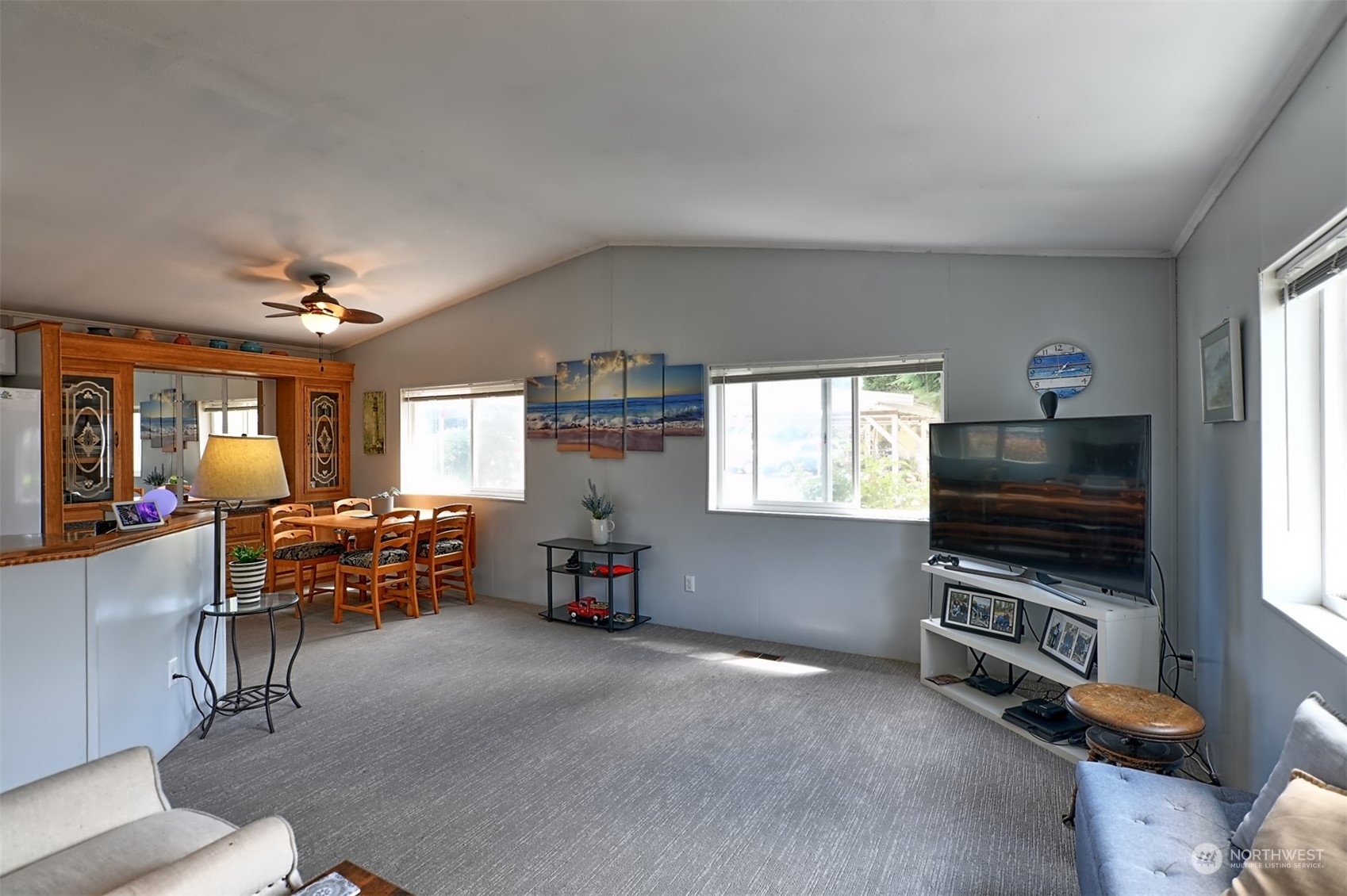 23825 15th Avenue Southeast, Unit 93 Bothell, WA 98021 - Photo 7 of 21 a living room with furniture and a flat screen tv
