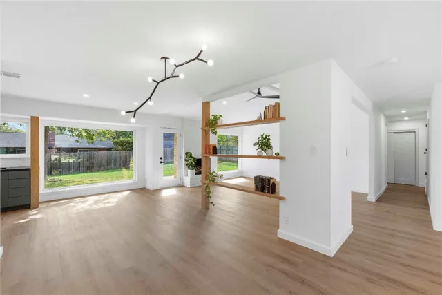 a view of a living room and hardwood floor