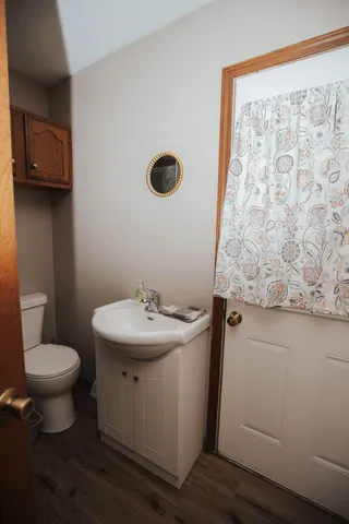 a bathroom with a sink toilet and vanity