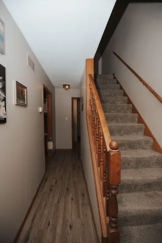 a view of stairs and wooden floor