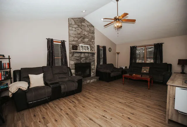 a living room with furniture and a fireplace
