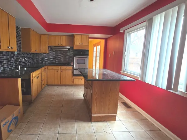 a kitchen with stainless steel appliances a counter top space