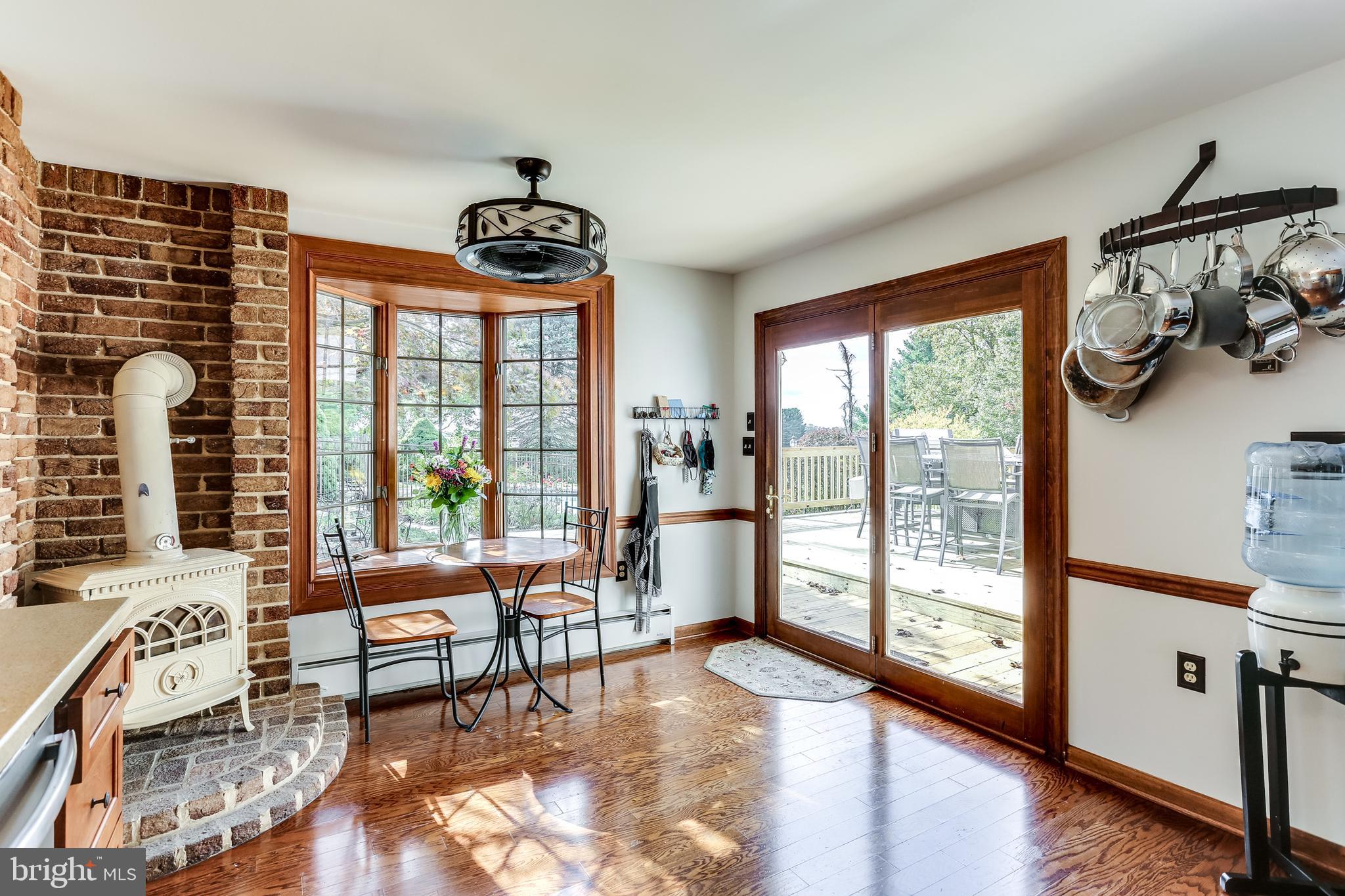 13829 Howard Road Dayton, MD 21036 - Photo 9 of 42 Kitchen w/wood burning stove and bay window