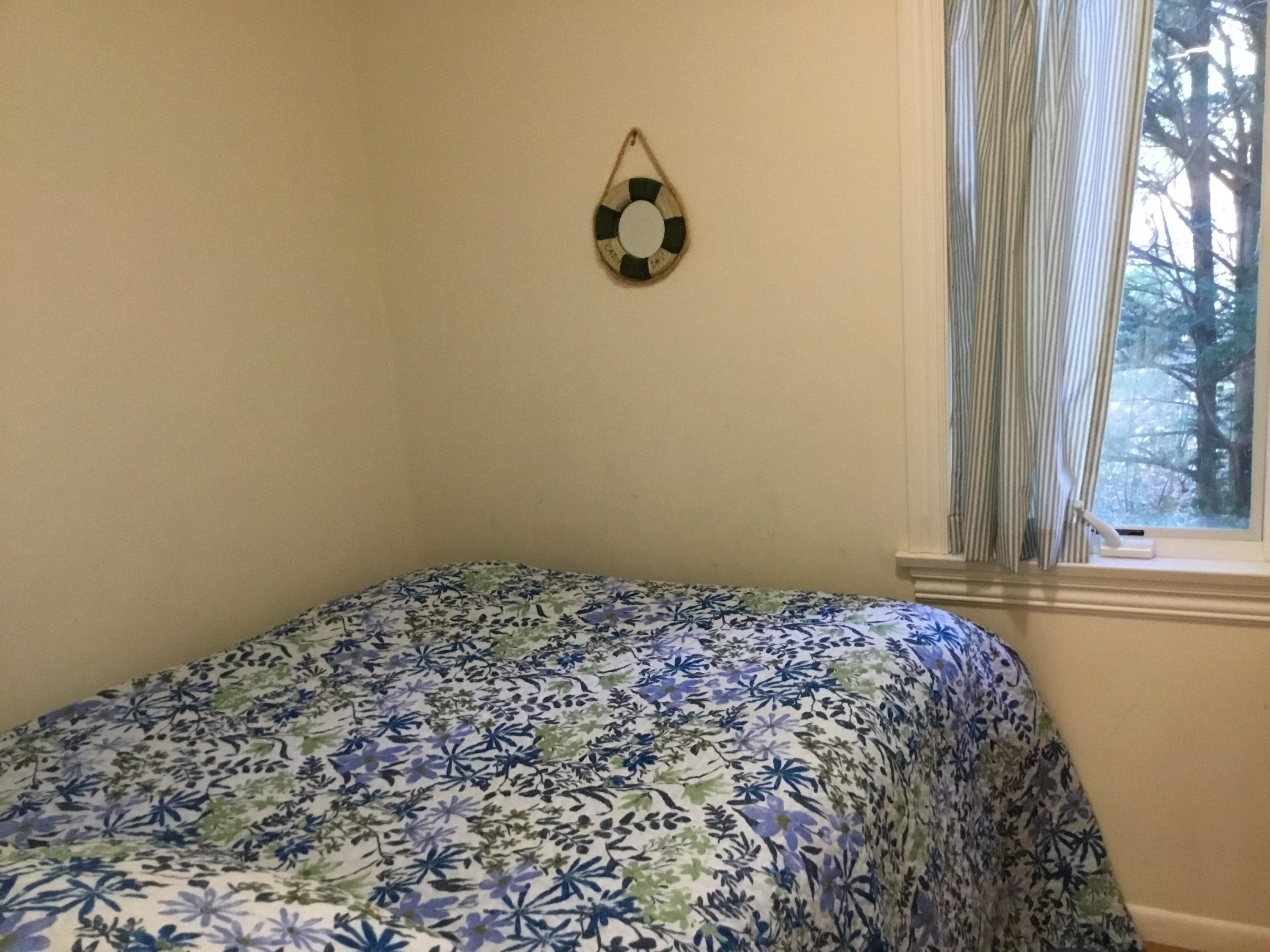 198 Fells Pond Road Mashpee, MA 02649 - Photo 32 of 33 a bedroom with a bed and a window