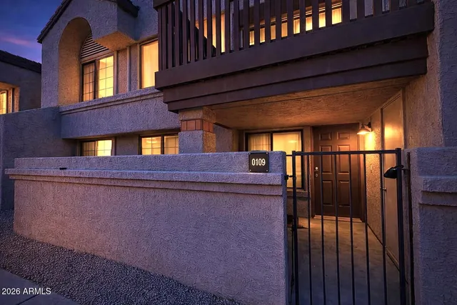 a view of an chairs and table in the balcony