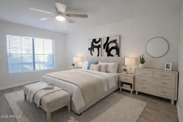 a bedroom with bed and window